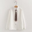 Bộ 3 món áo gile len cardigan thêu chữ cùng sơ mi và cổ đeo cà vạt.