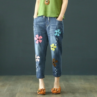 Quần thêu hoa sờn rách